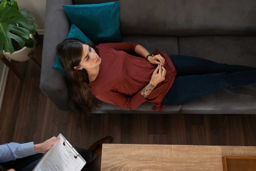 a-woman-laying-in-therapy-at-rehab